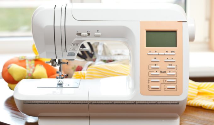 beginner using computerised sewing machine